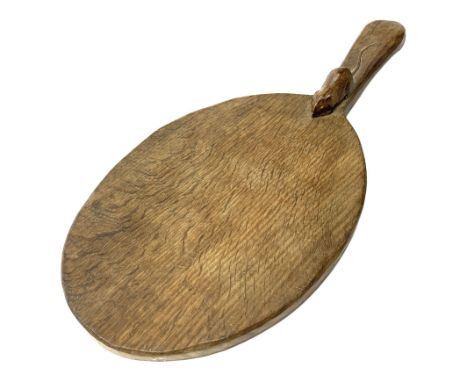 'Mouseman' oak oval cheese board, the raised handle with a carved mouse signature, by Thompson of Kilburn Dimensions: Length/