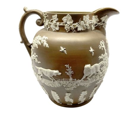 Large 19th century Jasperware jug, of exhibition size, probably Wedgwood or Copeland Spode, the brown ground decorated with h