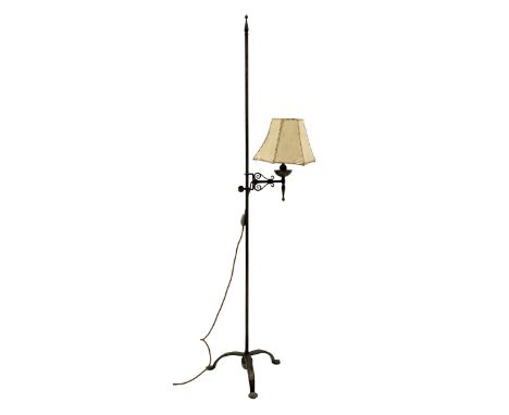 Cast and wrought metal standard lamp, single adjustable branch with a vellum shade, plain rod column with finial on tripod ba