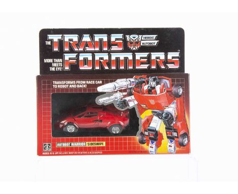 Vintage Hasbro Transformers G1 Autobot Sideswipe, in original box, opened bubble, complete with all weapons/accessories, inst