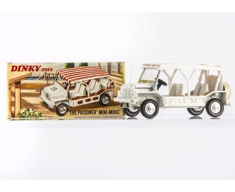 A Dinky Toys 106 "The Prisoner" Mini-Moke, white body, red/white canopy, silver windscreen frame, brown side panels, cast spu