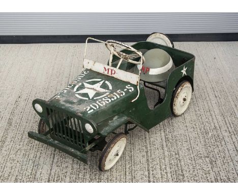 A Tri-ang Toys Military Police Jeep Pedal Car, as shown in the 1959 catalogue, military green pressed steel body, 'MP' in red