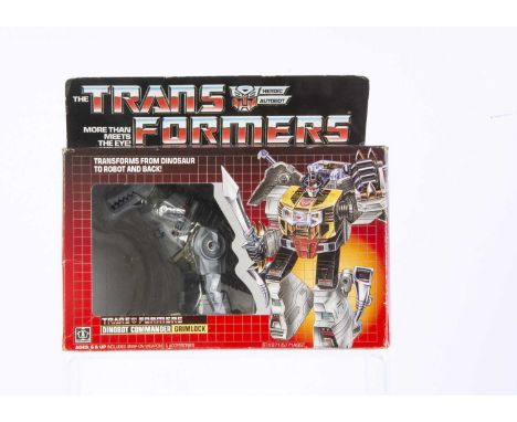 Vintage Hasbro Transformers G1 Autobot Dinobot Grimlock, in original box, opened bubble, complete with all weapons/accessorie
