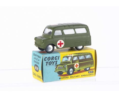 A Corgi Toys 414 Bedford Military Ambulance, olive drab body, undivided windscreen, red cross labels, flat spun hubs, in orig