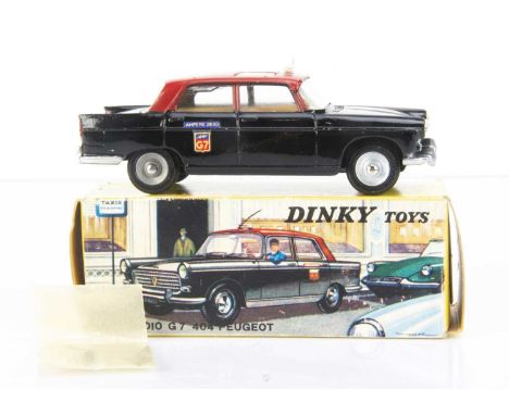 A French Dinky Toys 1400 Peugeot 404 G7 Taxi, black body, red roof, light brown interior, taxi sign, 'Ampere 28-30' and 'G7' 