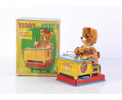 A Yonezawa (Japan) Battery-Operated Teddy The Artist, c.1959, tinplate base, chair and table with seated Teddy figure in fabr