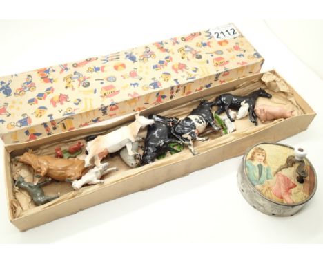 Set of Britains type cast metal farm animals in original box and a vintage childrens music box dated 1923 
