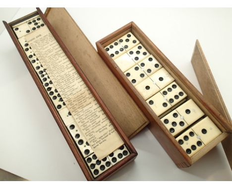 Two boxed cased sets of vintage Dominos 