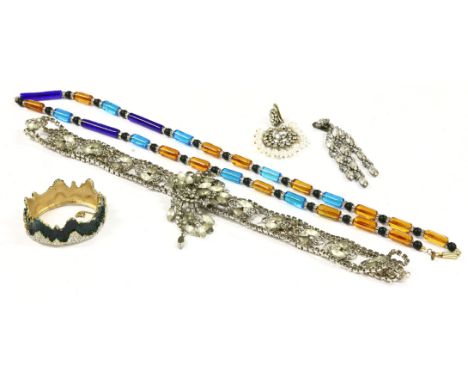 A gold-plated paste set hinged crown bangle,by Mimi di N, with dark green enamel decoration,a tubular glass and bead necklace