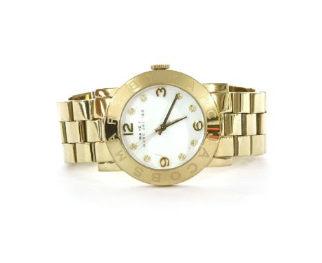 A ladies' gold-plated Marc Jacobs quartz bracelet watch,a white enamel dial with Arabic and diamanté set points, signed to di
