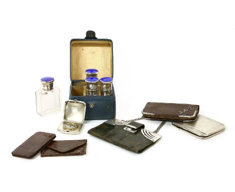 A cased vanity glass bottle set, each bottle with blue guilloché enamel and silver lids, Birmingham 1929, Adie Brothers Ltd.,