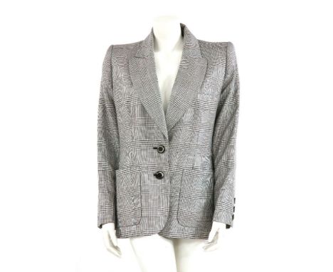 A vintage Yves Saint Laurent dog-toothed patterned jacket,with lapel and single-breasted button-up front, pockets and origina