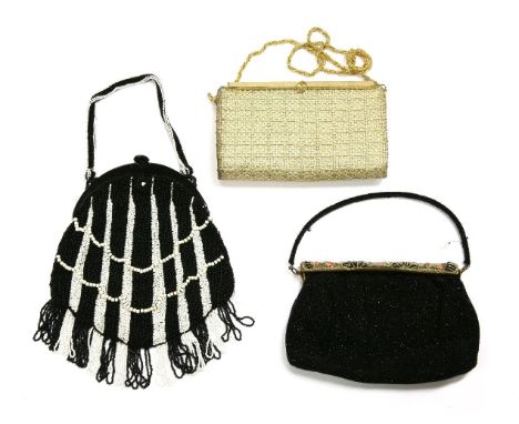 A vintage Gucci evening handbag,a metallic gold-coloured woven fabric handbag with gilt metal double 'G' clasp and twisted he