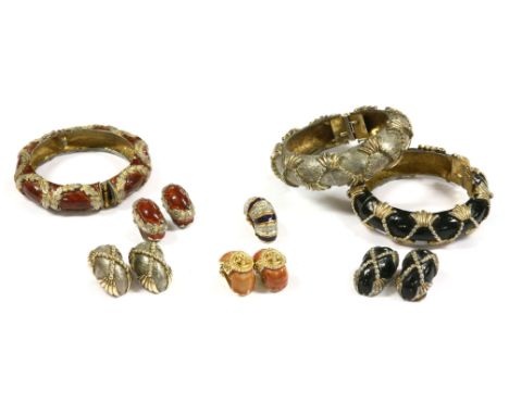Three hinged bangles and earring suites,by Kenneth J Lane, two enamelled in black and brown,a further pair of clip-on earring