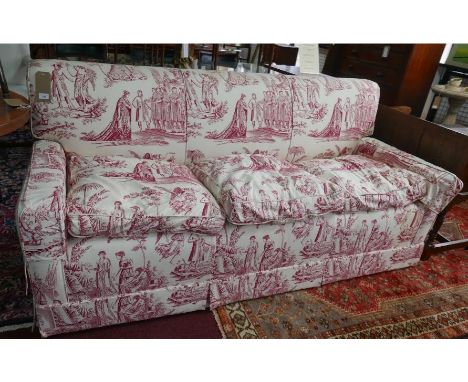 A 20th century three seater sofa with red and white upholstery depicting classical scenes, H.85 W.186 D.79cm 
