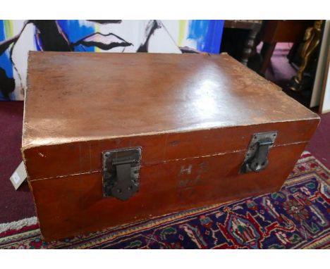 A Chinese tan leather bound trunk with twin carrying handles. H.35 L.82D.56cm 