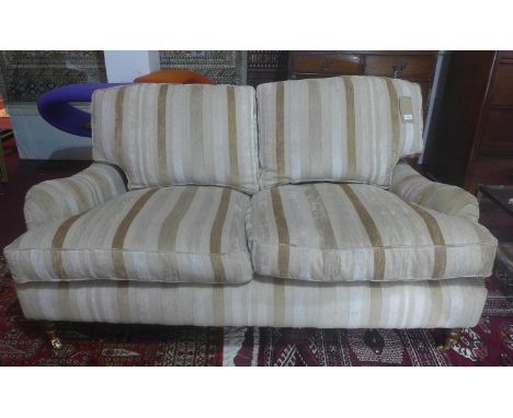 A contemporary two seater sofa 