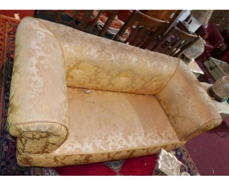 An early 20th century Chesterfield sofa with floral damask upholstery, raised on turned legs and castors 