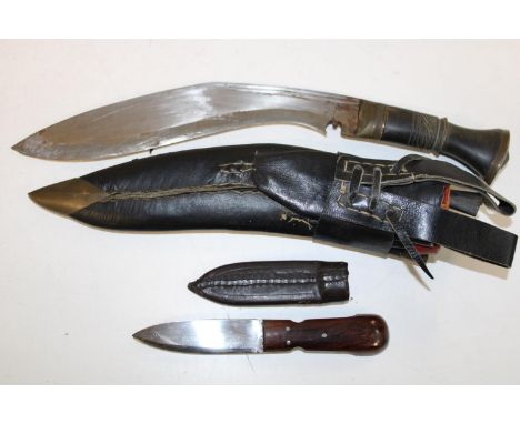 A vintage Kukri knife in scabbard with small skinning knife 