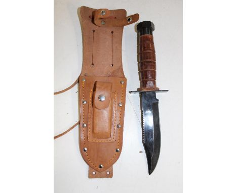 An American type fighting knife and scabbard complete with sharpening stone 