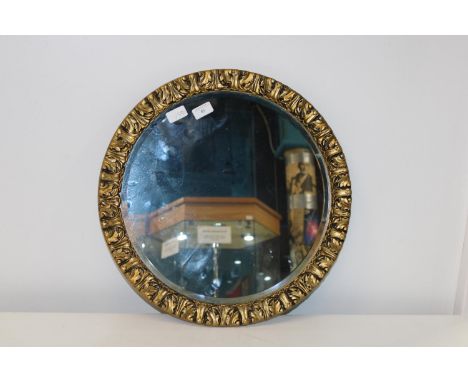 A vintage gilt framed bevelled edged mirror 51cm in diameter 
