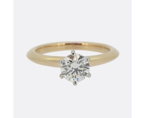 Tiffany &amp; Co. 0.69 Carat Diamond Engagement Ring.      Weight: 3.3 grams Ring Size: H (46) Band Width: 2mm Diamond Carat 