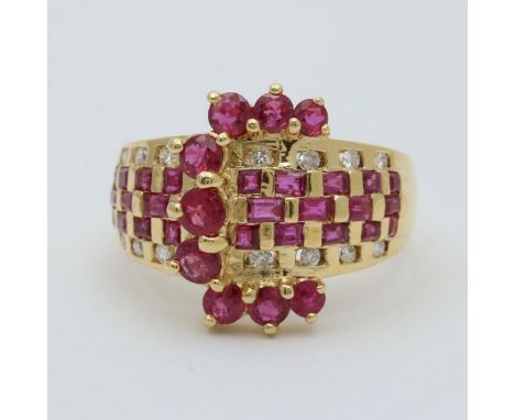 Vintage Ruby and Diamond Buckle Ring.                      Metal: 18K Yellow Gold Weight: 9.3 grams Ring Size: 7.75 (slightly