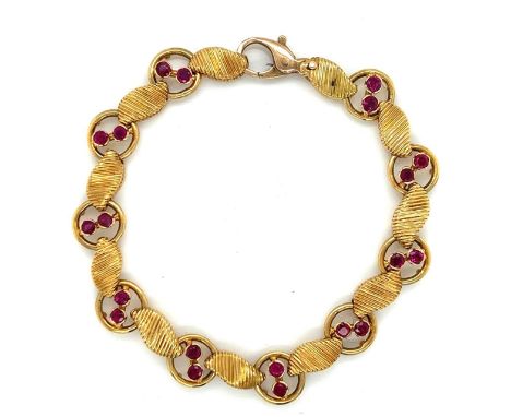 18K Yellow Gold Burma Ruby Bracelet.                  Weighing 33.1 grams Set with 20 Burmas weighing app. 2.00 Ct. 7.25 inch