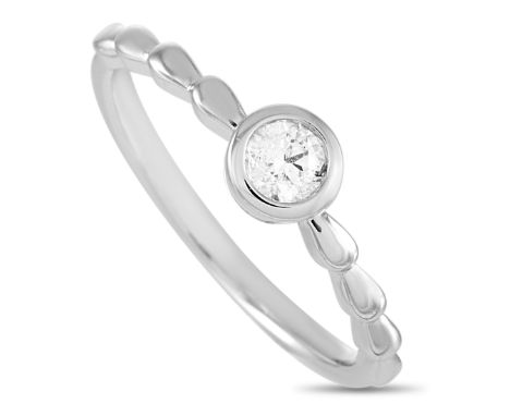 This LB Exclusive ring is crafted from 14K white gold and weighs 1.9 grams. It boasts band thickness of 1 mm and top height o