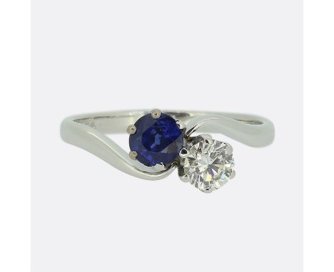 Vintage Sapphire and Diamond Two-Stone Crossover Ring.                       Weight:Â&nbsp;3.4 grams Ring Size:Â&nbsp;O 1/2 (