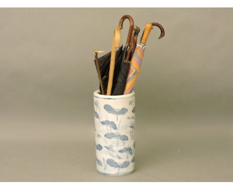 A reproduction Chinese blue and white stick stand, and contents, 47cm high