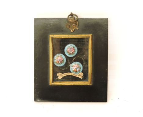 A set of three Georgian enamel buttons, painted with flowers by Henry Bone (1747-1834), framed.12 x 10.5cm overall.