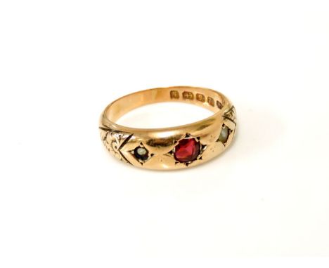 A 12ct gold red stone possibly garnet and split pearl ring, pearls damaged 4.67g