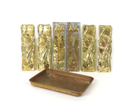 A pair of Art Nouveau finger plates, 27cm x 7.5cm, and two pairs of embossed 'peacock' finger plates, 25.5cm x 7cm and a tape