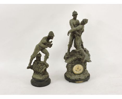 After Xavier Raphanel, a spelter mounted mantle clock, surmounted with a fireman rescuing his colleague, titled 'Victorie Du 