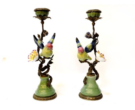 A pair of ceramic and cast metal candlesticks, modelled as love birds on blossom branches, stamped William Lowe 1894