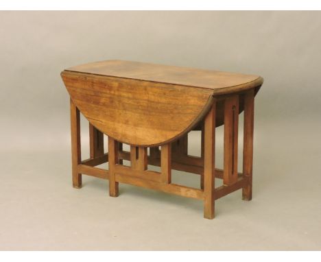 Arts and Craft period low dropleaf table, with gate action