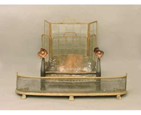 A wrought iron fire grate with later flower head terminals, together with a mesh fire screen, a glazed fire screen and a pier