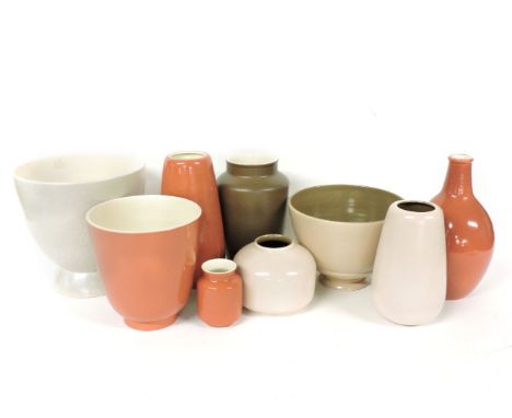 Poole Pottery, a collection of vases and bowls in peach, cream and brown, largest 22.5cm high (9)