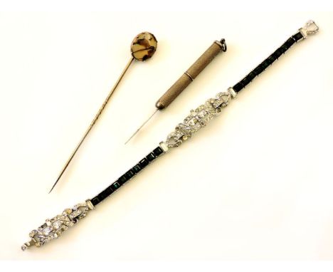 A sterling silver tooth pick, a Georgian moss agate link, later mounted as a stick pin, a Trifari green and white paste Art D