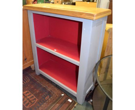 A modern light oak topped grey and red painted two shelved open cupboard