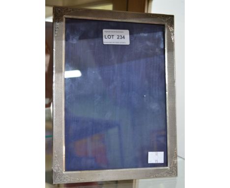 A silver photograph frame, stamped .800, possibly Italian, bears a Roma retail label to the reverse, polished wood easel back