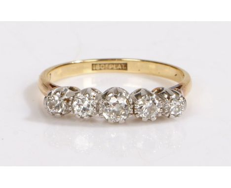 An 18ct yellow gold ring set with five diamonds.Approx. total diamond carat weight: 0.50cts. Colour: I. Clarity: SI1-SI2.Ring