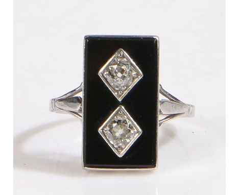 An art deco white metal rectangular onyx and diamond set ring.Total approx. diamond carat weight 0.50cts. Colour: K. Clarity: