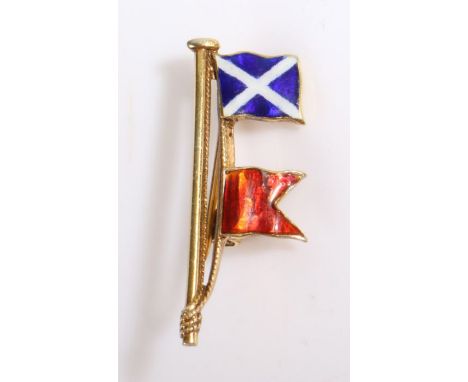 A 9ct yellow gold flag pole brooch with two enamel flags.Measurements: 30 x 11mm.Weighing 2.40 grams. Used, in very good cond