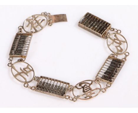 A 14ct gold Chinese bracelet with four abacus' with miniature wooden beads and four character links.Length 17.50 cm.Weighing 