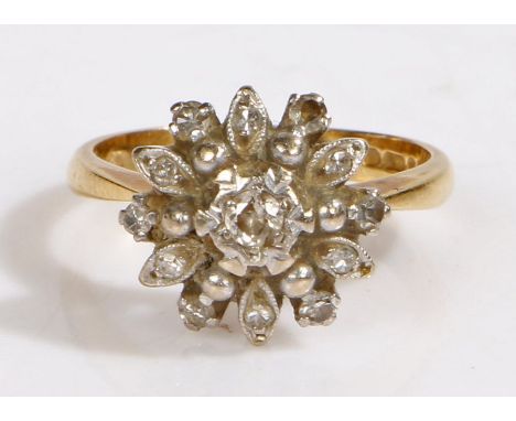 An 18ct yellow gold diamond cluster ring.Total approx. diamond carat weight: 0.25cts. Colour: J-K. Clarity: I1-I2.Ring size M