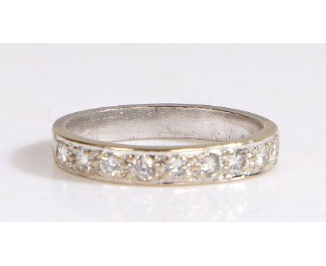 A platinum diamond set half eternity ring.Approx. total diamond carat weight: 0.27cts. Colour: G-H. Clarity: VS2-SI1.Ring siz