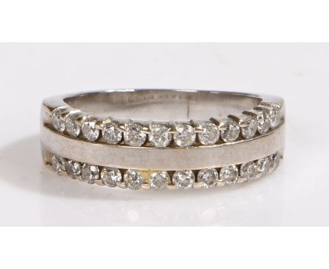 A 14ct white gold two band diamond ring. Total approx. diamond carat weight 0.50cts. Colour: H-J. Clarity: SI2-I1.Ring size R