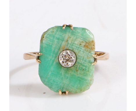 A 9ct yellow gold art deco rectangular jade ring with a solitaire diamond.Approx. measurements of jade: 14.17 x 11.90 x 2.81m